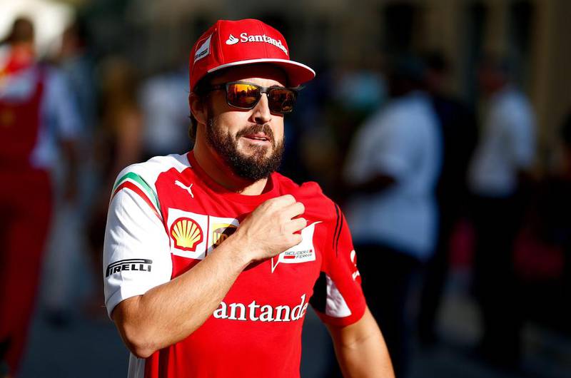 Abu Dhabi Grand Prix fan favourite Fernando Alonso of Scuderia Ferrari walks along the paddock. Valdrin Xhemaj / EPA