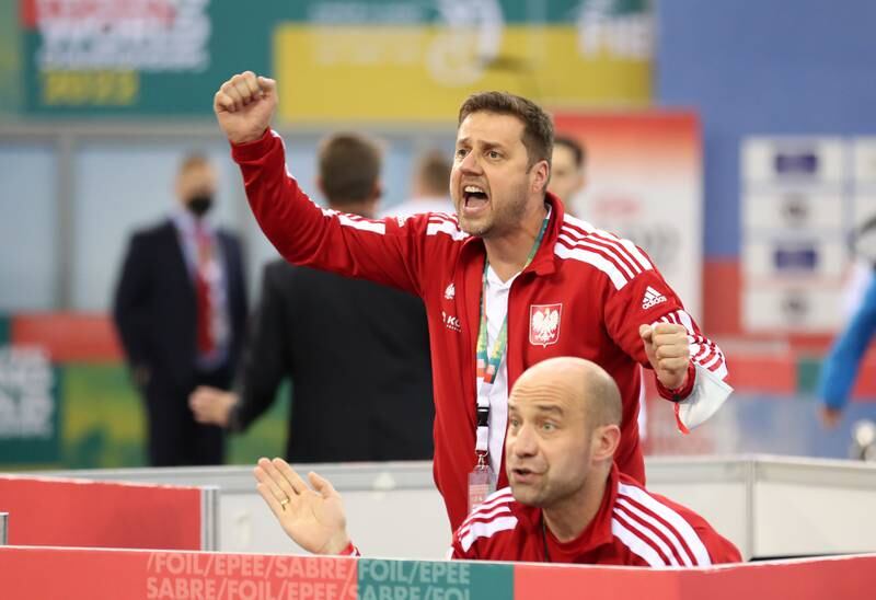 Poland's coaches celebrate a point.