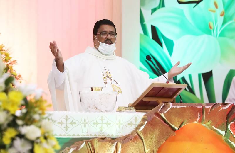 Father Andre during the Easter Sunday Mass held at St Mary's Catholic Church in Dubai. Pawan Singh / The National