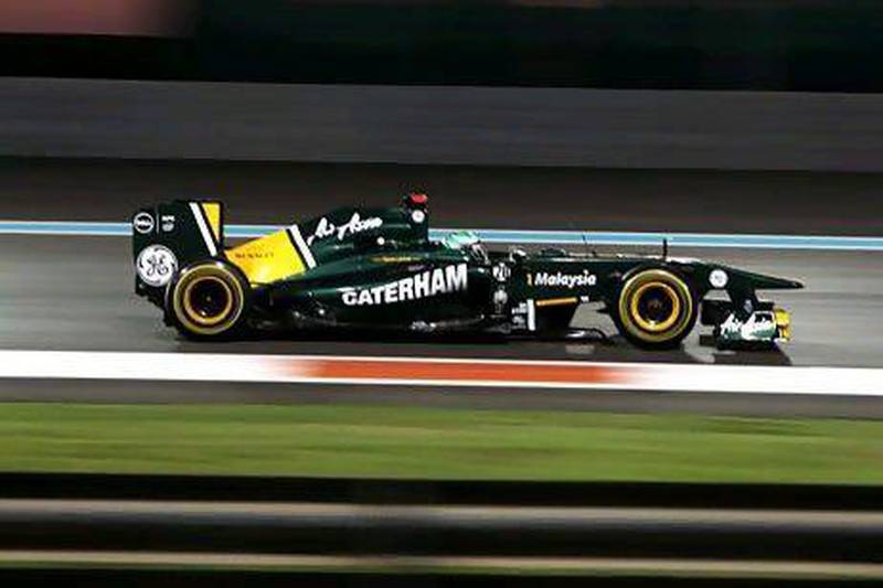 Team Lotus' driver Jarno Trulli drives at the Yas Marina circuit. Team Lotus, which started competing in the sport last year, landed a sponsorship deal this season with GE. Marwan Naamani / AFP