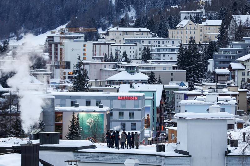 Security personnel stand on a rooftop for a briefing ahead of WEF. Bloomberg
