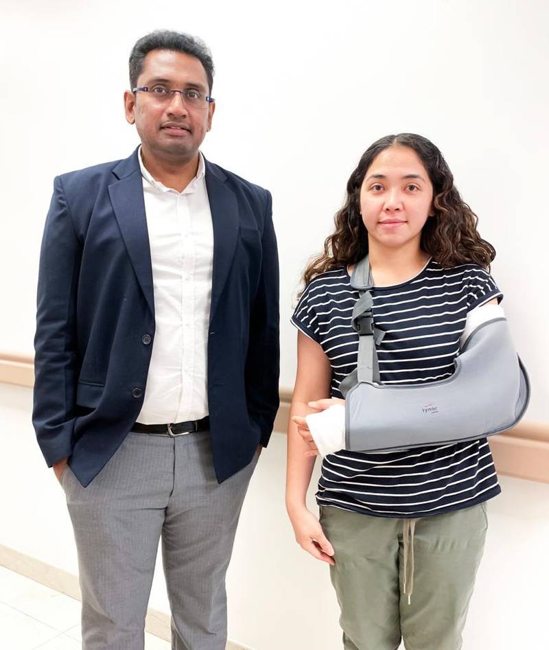 Dr Raghavendra Siddappa, orthopaedic specialist, with Pinky Caballero, who badly injured her arm when she fell from an e-scooter. Photo supplied.
