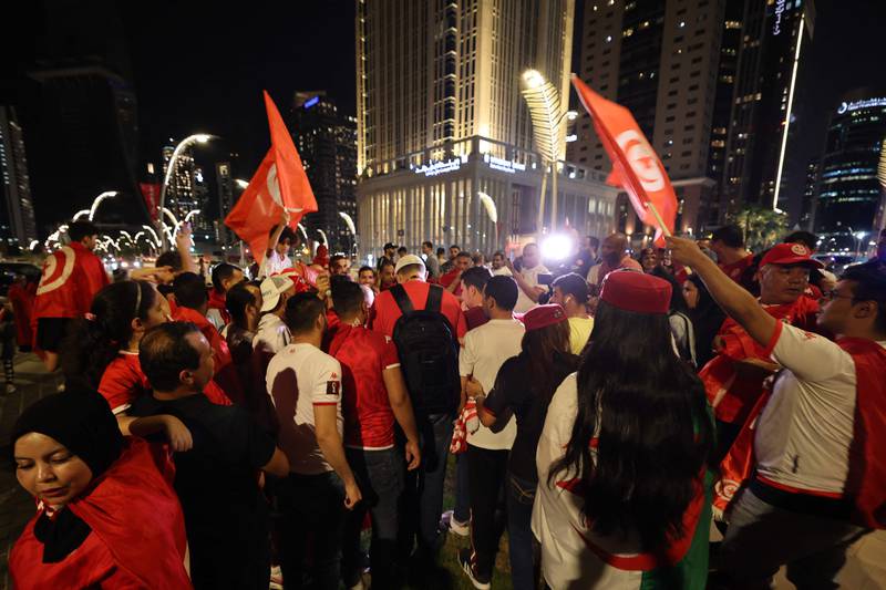 Tunisia supporters gather in front of their team's hotel in Doha. AFP