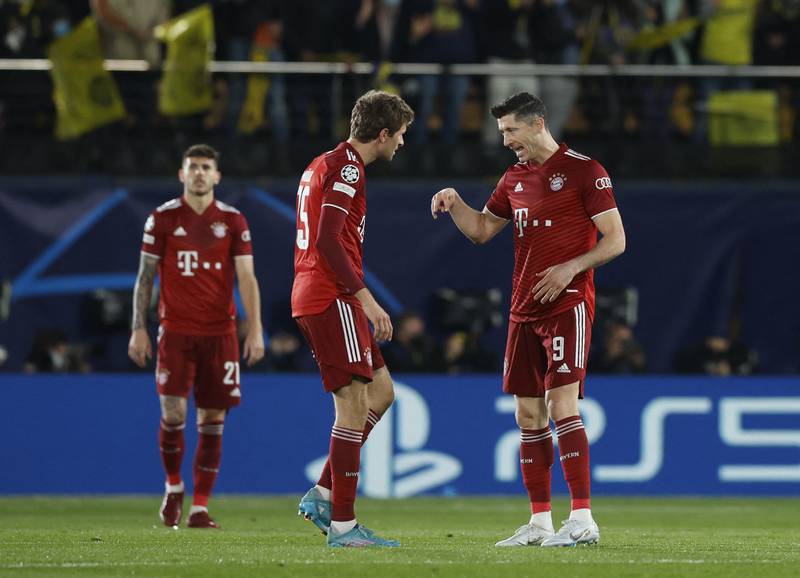 Bayern's Robert Lewandowski and Thomas Muller react after Villarreal's Arnaut Danjuma scored their first goal. Reuters