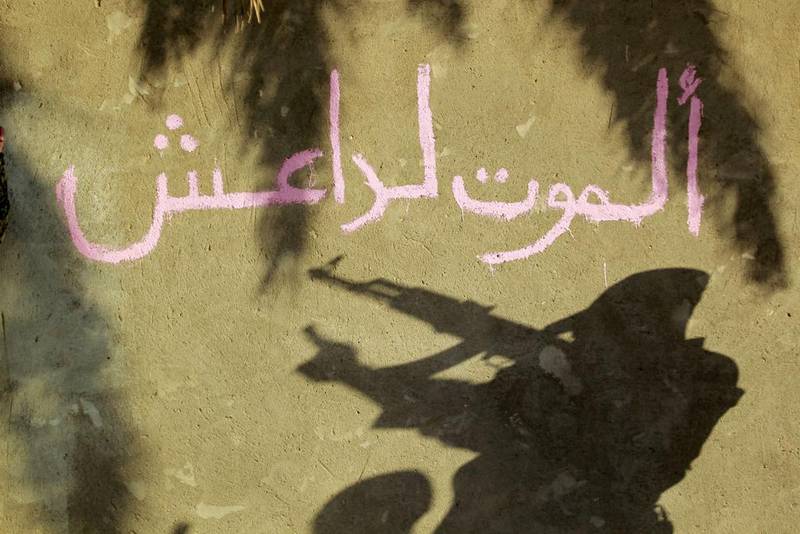 Graffiti on the wall reads "Death to Islamic State" near the Shiite shrine city of Karbala in Iraq. (AFP/ Haidar Hamdani)