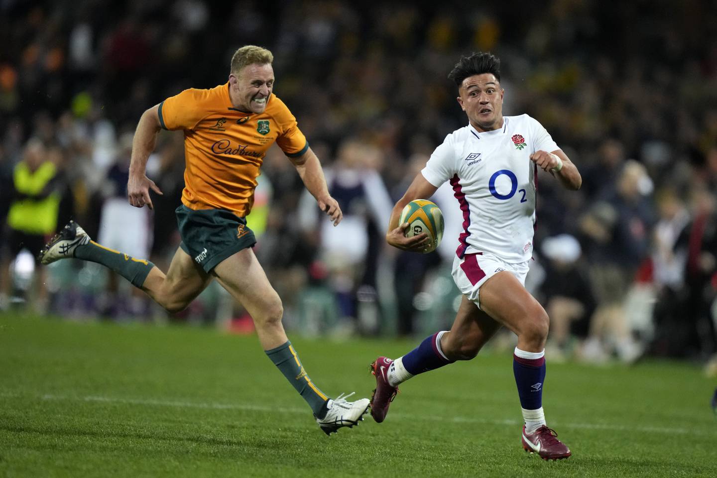 England's Marcus Smith, right, runs away from Australia's Reece Hodge on his way to scoring a try. AP Photo 