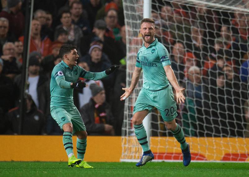 Arsenal's Shkodran Mustafi, right, celebrates scoring the first of his two goals. EPA