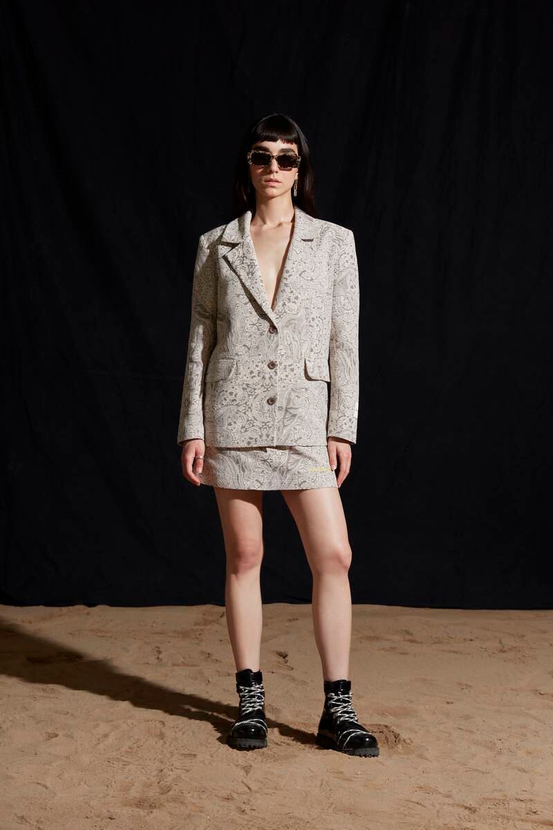 Horse motif fabric as a boxy jacket and mini skirt. 