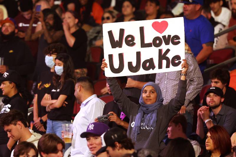 A fan holds up a sign reading "We Love U Jake" during the cruiserweight bout between Jake Paul and Anderson Silva. AFP