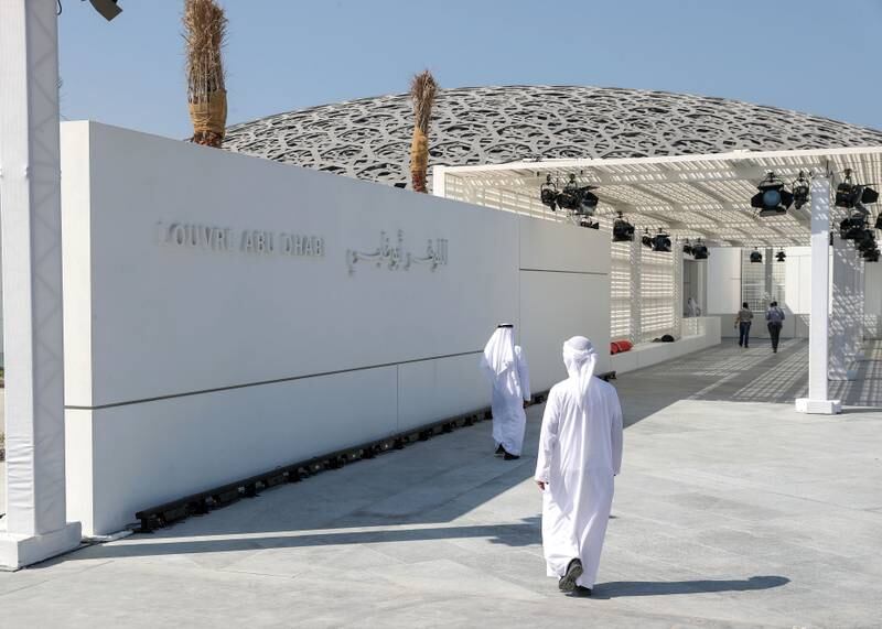 Abu Dhabi, United Arab Emirates - November 7th, 2017: Two gentlemen walk towards the Louvre. Louvre press Day. Tuesday, November 7th, 2017 at Louvre, Abu Dhabi. Chris Whiteoak / The National