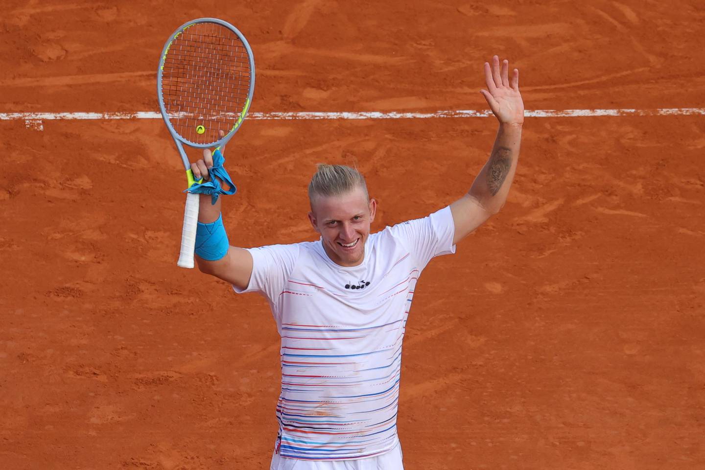Alejandro Davidovich Fokina celebrates after beating Djokovic for the best win of his career. AFP
