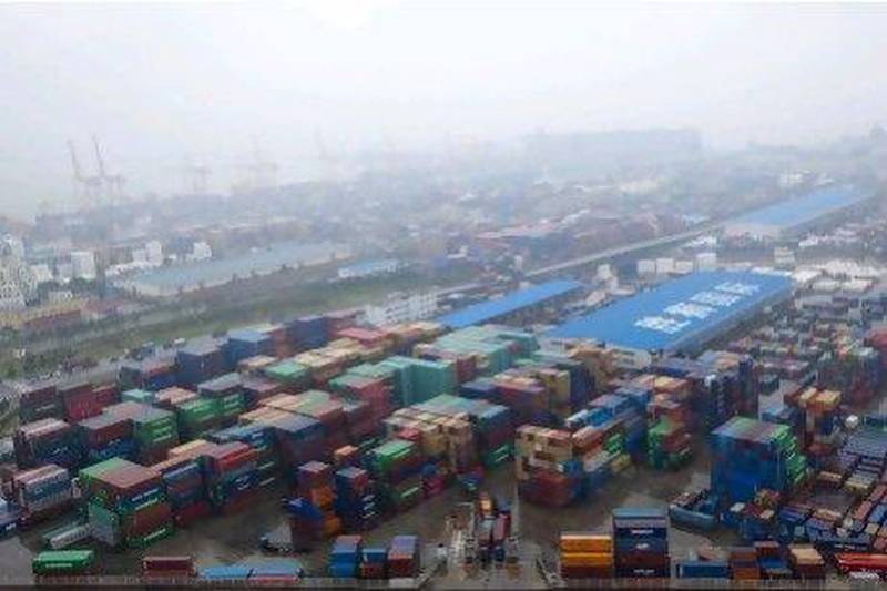Containers are stacked at the Dayaowan Bonded Port Area in Dalian, China. Nelson Ching / Bloomberg