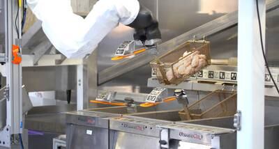 Miso Robotics' Flippy 2 cooking chicken wings. The company highlights that the device can work in narrow spaces and without breaks. All photos: Miso Robotics