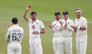 England bowler James Anderson, second left, celebrates reaching 600 Test wickets during the drawn third Test against Pakistan. Getty