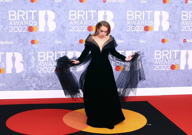 Adele poses for photographers on arrival at the Brit Awards 2022 in London on February 8, 2022. AP