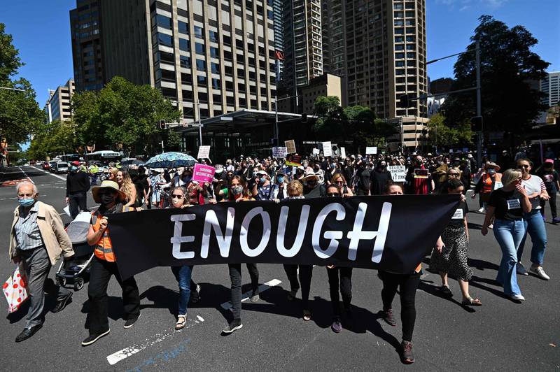 CORRECTION / Protesters attend a rally against sexual violence and gender inequality in Sydney on March 15, 2021.  / AFP / Steven Saphore
