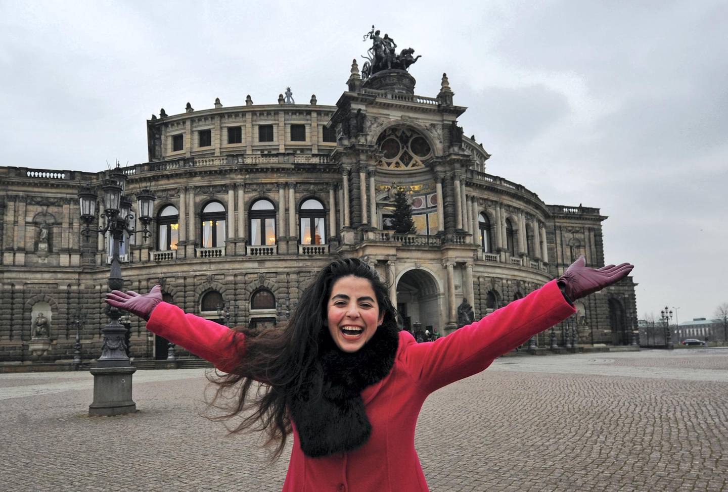 Egyptian mezzo soprano Gala El Hadidi poses in front of the Semper opera house in Dresden, Germany, 01 December 2014. Photo: Matthias Hiekel/dpa | usage worldwide   (Photo by Matthias Hiekel/picture alliance via Getty Images)