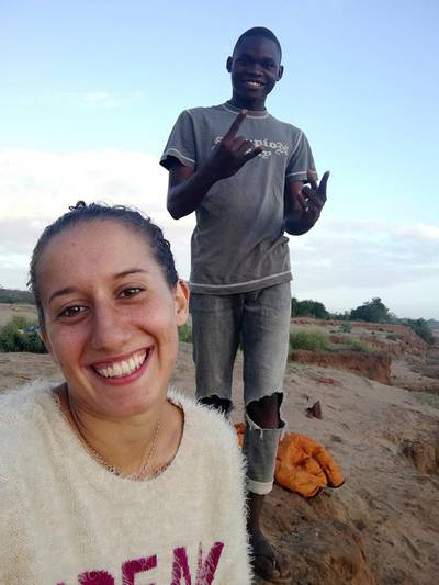 FILE - In this August 2018 file photo, Italian volunteer Silvia Costanza Romano, left, poses with local resident Ronald Kazungu Ngala, 19, in the village of Chakama, in coastal Kilifi county, Kenya. Italian Premier Giuseppe Conte has announced that an Italian aid worker kidnapped in late 2018 while she was working in Kenya has been freed. Conte tweeted Saturday: â€œSilvia Romano has been freed. Thanks to the men and women of the foreign intelligence services. Silvia, weâ€™re waiting for you in Italy!â€ (AP Photo, File)