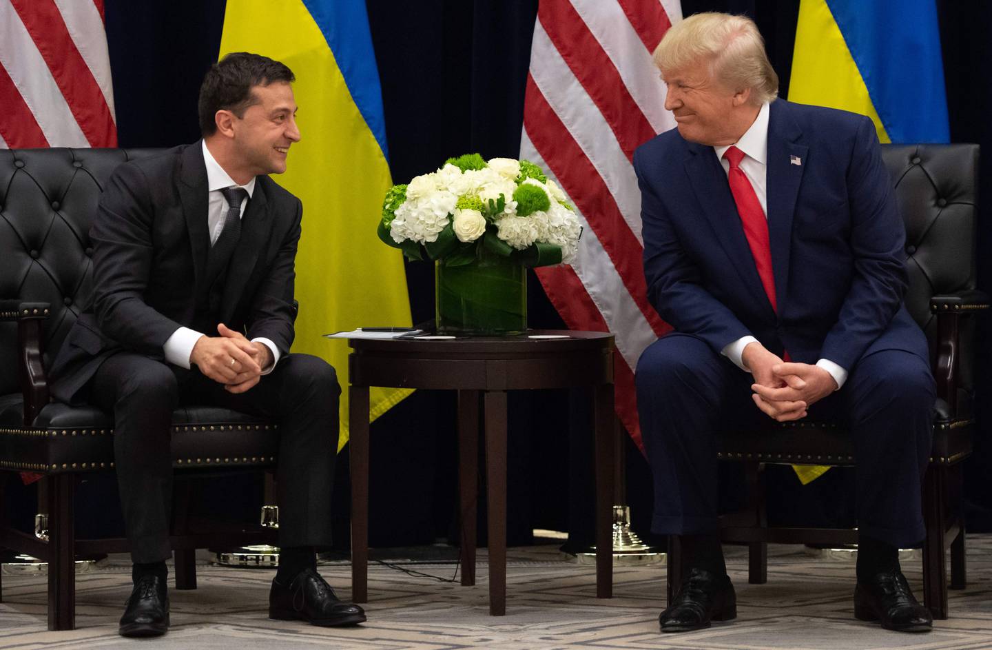 (FILES) In this file photo taken on September 25, 2019 US President Donald Trump and Ukrainian President Volodymyr Zelensky speak during a meeting in New York 
on the sidelines of the United Nations General Assembly. Donald Trump faces the prospect of becoming only the third US president to be impeached when open hearings begin this week into his alleged effort to bolster his re-election hopes by pushing Ukraine to find dirt on a Democratic rival. / AFP / SAUL LOEB
