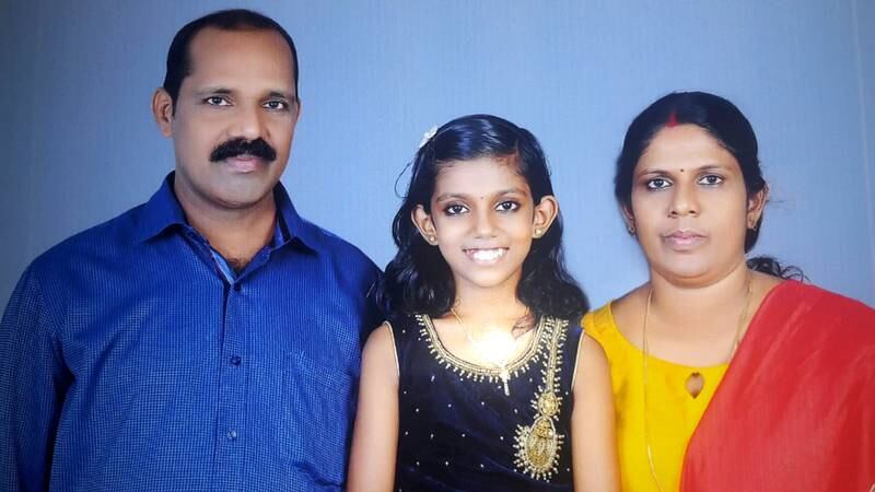 Sabu Chellappan with his daughter Devika and wife Ambily in happier times. The family in Kerala have been waiting close to three weeks for a June 7 cremation slot for Mr Chellappan after he died in Sharjah in May from Covid-19. Indian officials say they are working with crematoriums to reduce delays caused by higher deaths during the coronavirus outbreak and restrictions during the lockdown. Courtesy: Chellappan family 