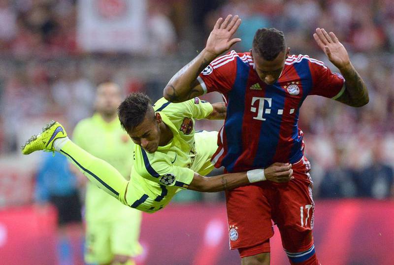 Bayern Munich's Jerome Boateng clashes with Barcelona's Neymar during their Champions League contest on Tuesday night. Andreas Gebert / EPA
