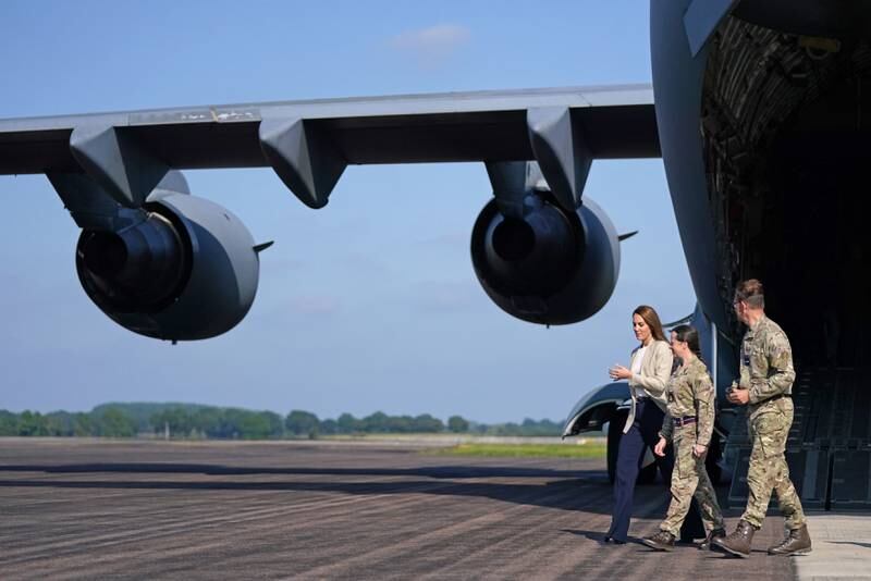 The Duchess of Cambridge walks near an RAF C17 Globemaster at RAF Brize Norton. Operation Pitting involved every unit at the military base.