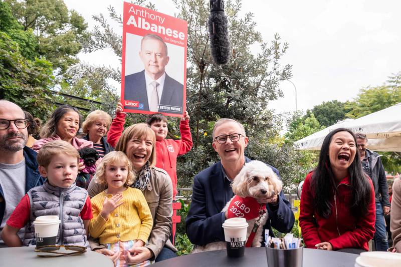 Mr Albanese (centre) meets with Labor candidate for Reid, Sally Sitou (right), and supporters after winning the general election at Marrickville Library and Pavilion in Sydney. AFP