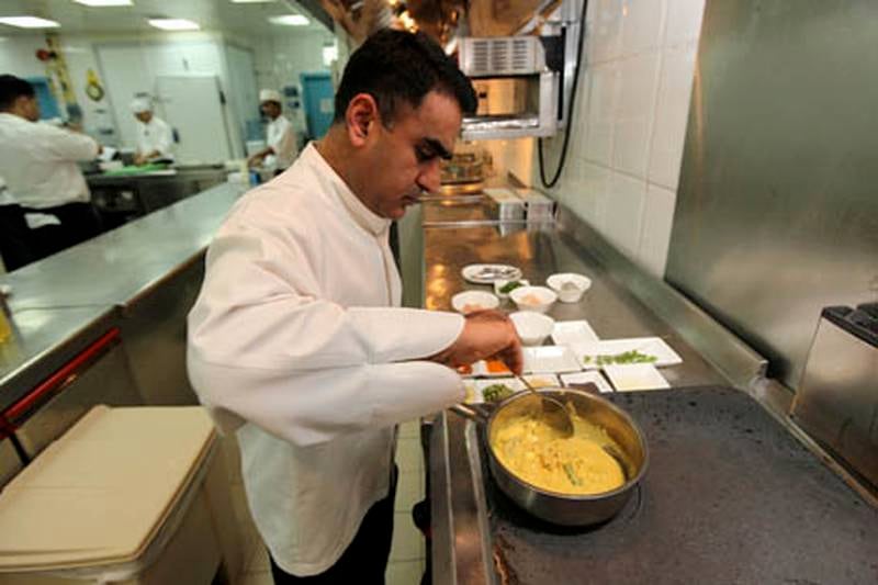 DUBAI, UNITED ARAB EMIRATES Ð Oct 11: Vineet Bhatia, Chef preparing Moilee dish in the kitchen of Indego restaurant at Grosvenor House in Dubai Marina in Dubai. (Pawan Singh / The National) For Arts & Life.