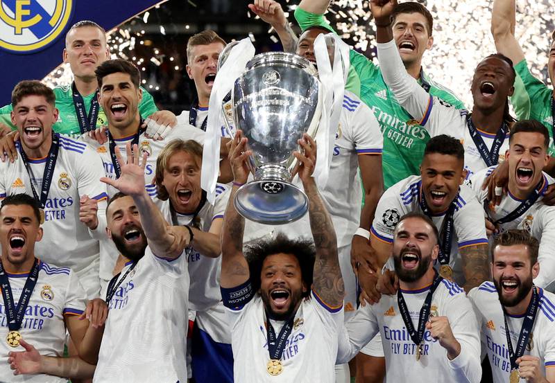 Real Madrid's Marcelo celebrates with the Champions League trophy after beating Liverpool in Paris in May 2018. Reuters