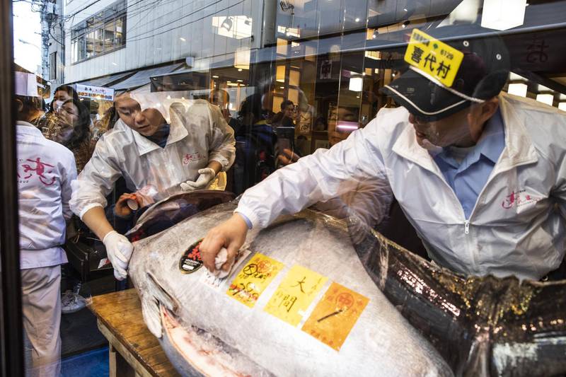 Employees clean the whole tuna at a Sushizanmai restaurant in Tokyo, Japan. Bloomberg