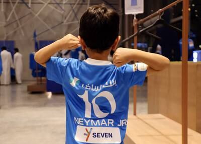 A young fan wearing an Al Hilal shirt with Neymar's name on it at the club shop. Reuters