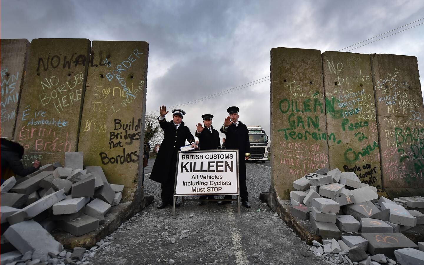 Members of the Border Communities against Brexit group dressed as customs officers take part in a mock border wall and customs checkpoint between Ireland and the UK. Getty Images