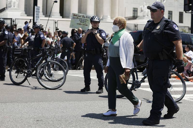 Barbara Lee is detained by police. AFP