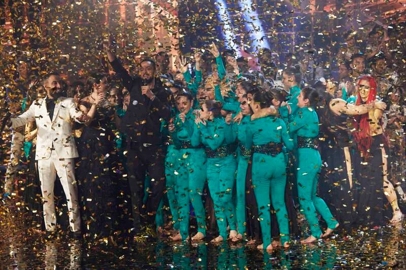 Mayyas celebrate with choreographer Nadim Cherfan (in black), after their ‘Arabs Got Talent’ win. Photo: MBC