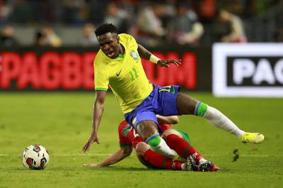 Morocco's Sofyan Amrabat fouls Brazil attacker Vinicius Junior. Reuters