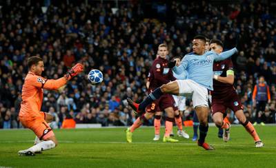 Soccer Football - Champions League - Group Stage - Group F - Manchester City v TSG 1899 Hoffenheim - Etihad Stadium, Manchester, Britain - December 12, 2018  Manchester City's Gabriel Jesus in action with Hoffenheim's Oliver Baumann    REUTERS/Andrew Yates