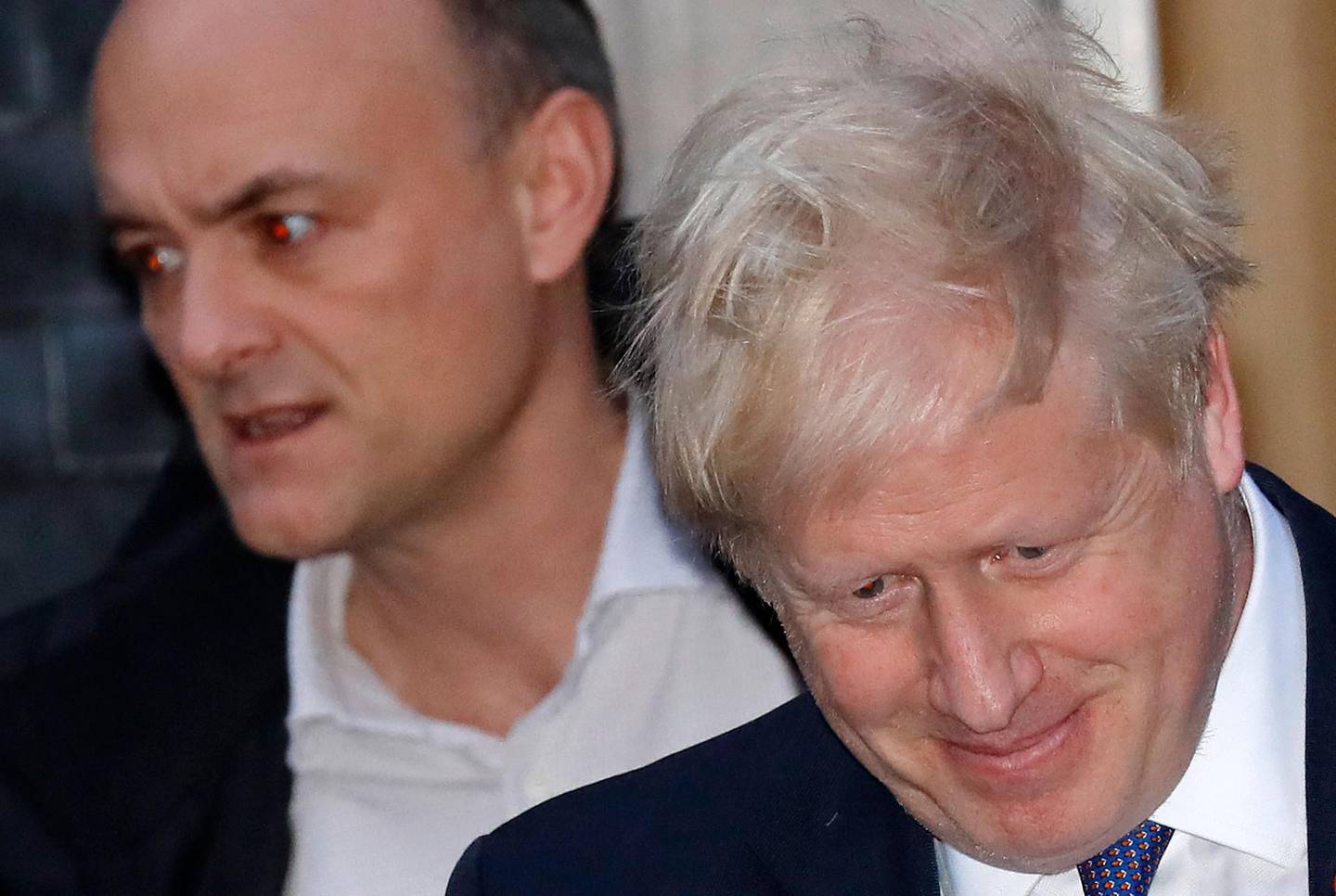 (FILES) In this file photo taken on October 28, 2019 Britain's Prime Minister Boris Johnson (R) and Number 10 special advisor Dominic Cummings leave from 10 Downing Street in central London. Brexit mastermind Dominic Cummings, the notoriously combative former top adviser to Prime Minister Boris Johnson, is not shirking his latest fight -- but this time has the UK leader himself in his sights. Cummings, 49, had lain low after acrimoniously quitting Downing Street in December. But on April 23, 2021, he returned with a bang, releasing a 1,100-word blog that detailed a series of explosive allegations against the Conservative leader. / AFP / Tolga AKMEN
