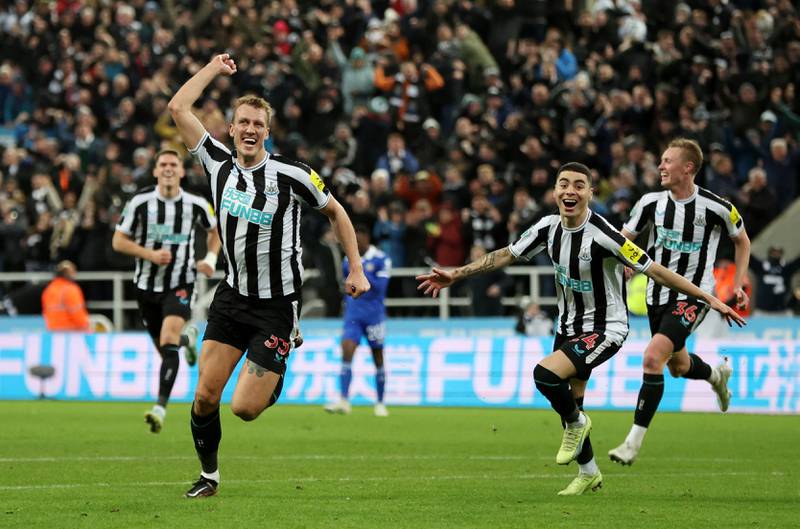 Dan Burn celebrates scoring Newcastle's first goal with teammates. Action Images