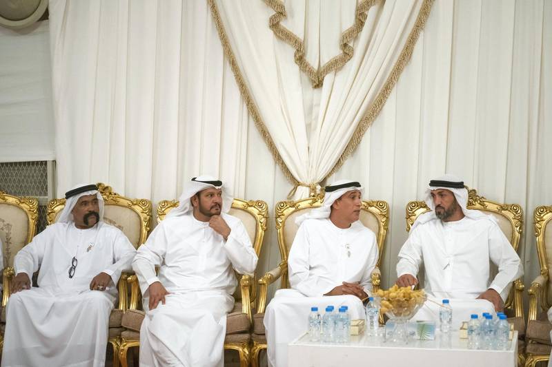 ABU DHABI, UNITED ARAB EMIRATES - September 25, 2019: HE Mohamed Mubarak Al Mazrouei, Undersecretary of the Crown Prince Court of Abu Dhabi (R) and HE Jaber Al Suwaidi, General Director of the Crown Prince Court - Abu Dhabi (2nd R), offer condolences to the family of HE Abdullah Al Sayyed Al Hashemi.

( Hamad Al Kaabi  / Ministry of Presidential Affairs )
---