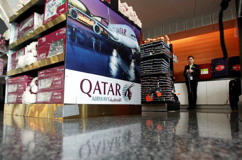 A sign of Qatar Airways is seen at Hamad International Airport in Doha. All international flights serving Qatar are banned from using Saudi and UAE airspace. Naseem Zeitoon / Reuters