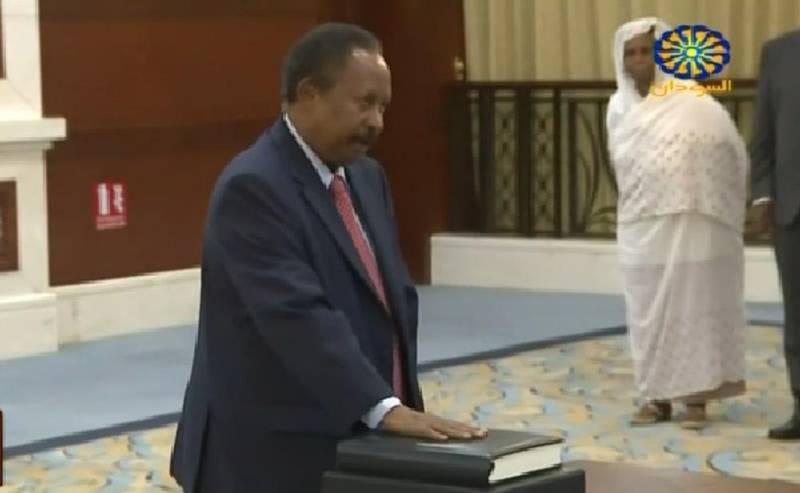 This screen grab taken from Sudan TV on August 21, 2019, shows Abdallah Hamdok during a swearing in ceremony in the Sudanese capital Khartoum.  Hamdok was sworn in today as the prime minister of a transition that is meant to guide Sudan to civilian rule, state media reported.
He took the oath during a brief ceremony, moments after flying in from Ethiopia, where he spent years working as a senior economist for the United Nations. - === RESTRICTED TO EDITORIAL USE - MANDATORY CREDIT "AFP PHOTO / HO / SUDAN TV" - NO MARKETING NO ADVERTISING CAMPAIGNS - DISTRIBUTED AS A SERVICE TO CLIENTS ===
 / AFP / Sudan TV / - / === RESTRICTED TO EDITORIAL USE - MANDATORY CREDIT "AFP PHOTO / HO / SUDAN TV" - NO MARKETING NO ADVERTISING CAMPAIGNS - DISTRIBUTED AS A SERVICE TO CLIENTS ===
