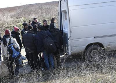 A group of migrants are detained after being caught by police on the side of the highway near the Greek-Turkish border. Getty Images