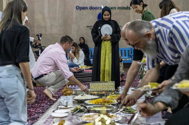 Visitors and residents enjoy iftar at the Sheikh Mohammed bin Rashid Al Maktoum Centre for Cultural Understanding.