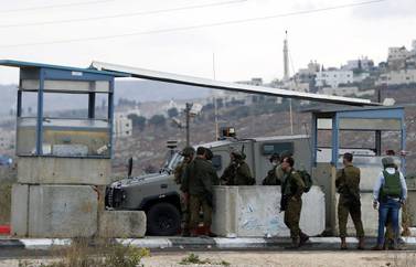 Israeli security forces secure the scene of an incident at the Hawara checkpoint near the Palestinian city of Nablus, in the Israeli-occupied West Bank, on November 4, 2020. Reuters