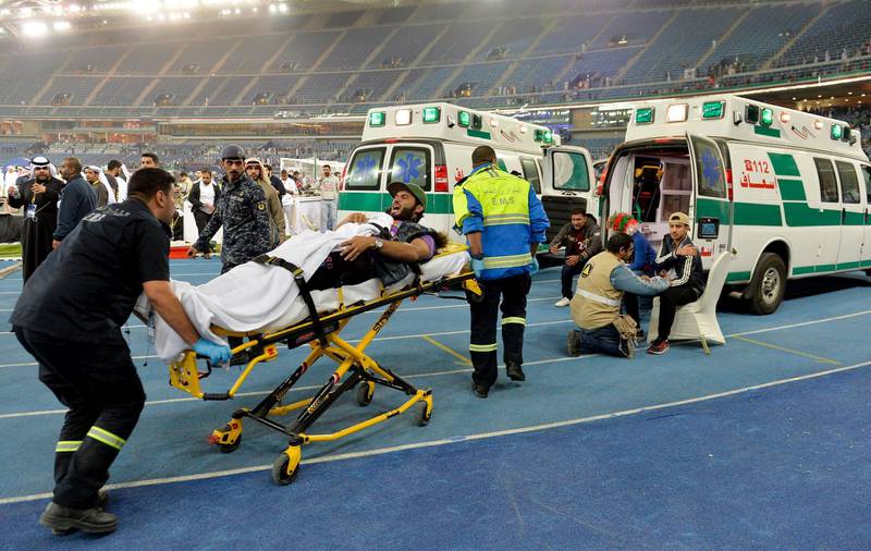 Medical staff treat injured fans after a glass barrier broke at the end of the Gulf Cup of Nations soccer Final match between Oman and UAE at Jaber Al-Ahmad International Stadium, Kuwait City, Kuwait, 05 January 2018. Noufal Ibrahim / EPA