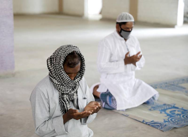 Muslims sit apart as they perform Eid Al Fitr prayers at home during lockdown, to combat coronavirus pandemic, in Kolkata, India. EPA