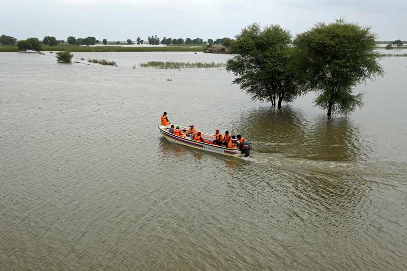 Rescue workers carry out an evacuation operation for those stranded in Rajanpur district of Punjab province. AFP