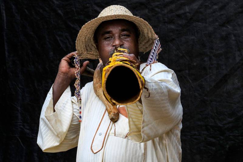 Dafallah Al Haj Ali Mustafa, 51, founder and general director of the Sudanese Traditional Music Centre and assistant professor of music and drama, plays a traditional 'wazza' instrument in the Sudanese capital's twin city of Omdurman. All photos: AFP