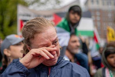 A woman weeps at a day of action for Palestinians event in Washington. AFP