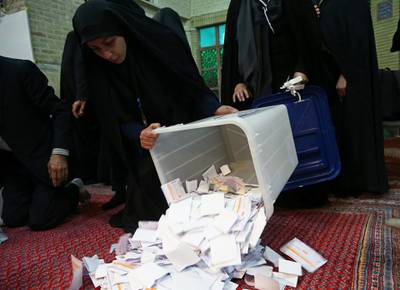 Poll workers empty full ballot boxes after the parliamentary election voting time ended in Tehran, Iran February 22, 2020. Nazanin Tabatabaee/ WANA (West Asia News Agency)/Nazanin Tabatabaee via REUTERS ATTENTION EDITORS - THIS IMAGE HAS BEEN SUPPLIED BY A THIRD PARTY.
